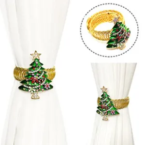 Fermatenda decorativo per tendaggi a forma di albero di natale con fascia elastica dorata.