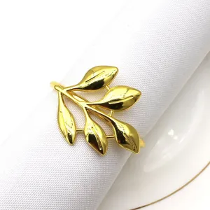 Close-up detail of the elegant gold leaf napkin ring showcasing exquisite metallic texture.