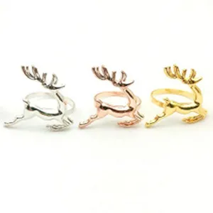 Detail shot of Christmas reindeer napkin rings in silver, rose gold and gold finishes.