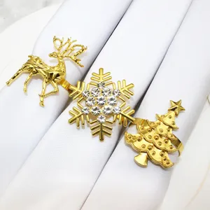 Gold Christmas napkin rings detail shot, featuring deer snowflake tree alloy table decor.