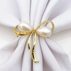 Pearl napkin ring detail showing the elegant bow design with alloy and sparkling rhinestones.