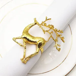 Golden reindeer napkin ring, elegant elk design metal tissue holder for Christmas decor.