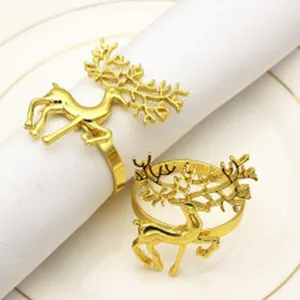 Gold reindeer napkin ring detail, elegant Christmas table decor accessory close-up view.