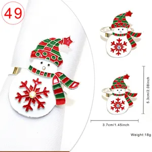 Christmas snowman napkin ring with red green checkered hat and sparkling crystal snowflake.