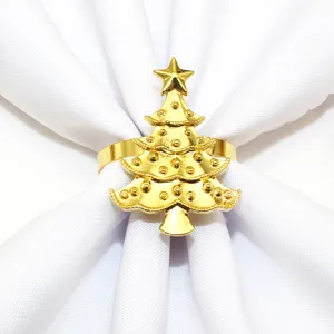Gold Christmas tree napkin ring detail, elegant metal holiday table decor accessory.