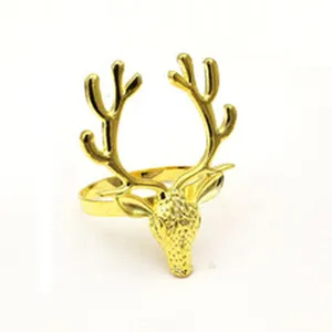 Gold reindeer napkin ring detail, metal elk table decor buckle for holiday dining.