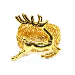 Gold metal reindeer curtain tieback detail, flexible spring design for holiday decor.