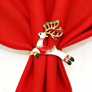 Detailed close-up of a Christmas rhinestone reindeer napkin ring with shiny crystals and red enamel.