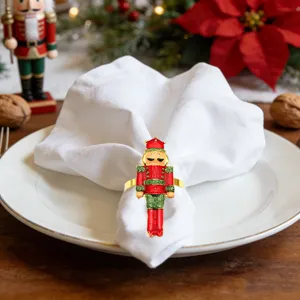 Christmas Nutcracker napkin ring detail view, red green soldier holiday table decoration.