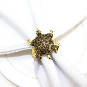 Gold turtle metal napkin ring for marine themed table decor and dinner party setting