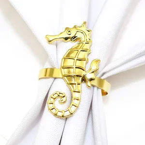 Gold seahorse napkin ring detail, exquisite metal craftsmanship for elegant dining table decor.