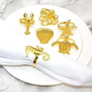 Gold ocean napkin rings set of 6, featuring seahorse and starfish details for table decor.