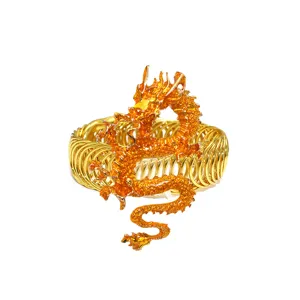 Close-up view of the golden Chinese dragon and spring structure on the metal curtain clip.