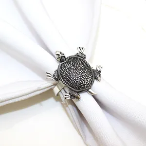 Turtle napkin ring metal nautical table decor detail shot for home kitchen dining parties.