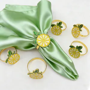 Gold lemon napkin rings set, elegant fruit table decor for hotel wedding parties.