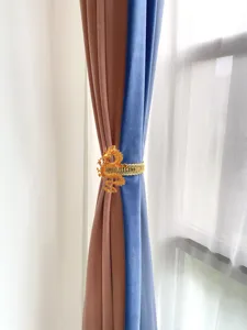 Golden Chinese dragon curtain tieback clip, punch-free metal spring holder for home decor.