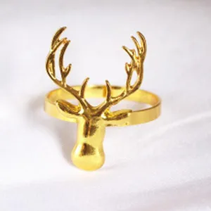 Detailed view of a golden deer napkin ring, featuring exquisite elk antler design for table decor.