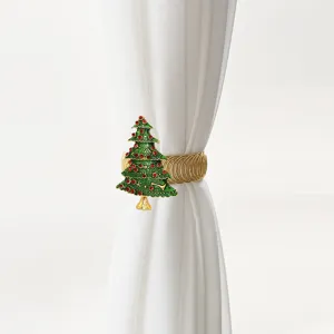 Close-up detail of the Christmas tree curtain buckle showing rhinestone and enamel craftsmanship.