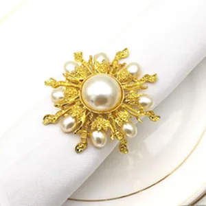 Elegant gold alloy pearl napkin ring detail shot, luxury table decor for hotel and wedding.