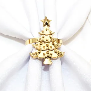 Closeup detail of a gorgeous golden Christmas tree napkin ring holding a crisp white napkin.