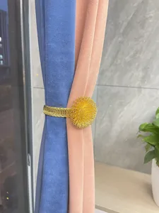 Metal curtain tieback with spring wire ball design for home window decoration accessories.