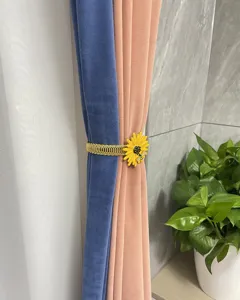 Spring metal curtain tieback with sunflower design, perfect for home decor and drapery holding.