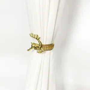 Gold metallic Christmas reindeer curtain tieback spring buckle detail shot closeup display