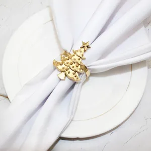 Gold Christmas tree napkin ring holder for holiday table decor, elegant hotel tableware accessory.