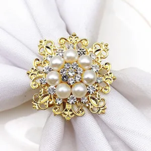Golden pearl napkin ring detail, elegant alloy tableware decor for dining table.