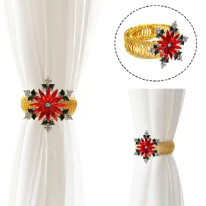 Close-up of Christmas red crystal snowflake metal spring curtain tieback buckle detail.