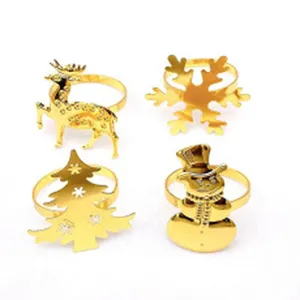 Gold Christmas napkin ring set featuring deer, snowflake, tree and snowman designs for table.