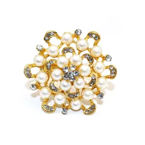 Close-up detail of luxury gold pearl rhinestone flower napkin ring for elegant table decor.