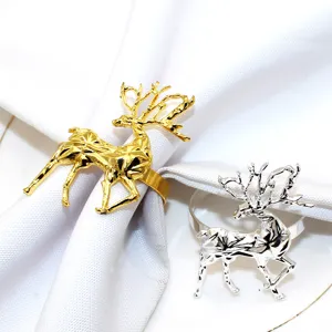 Gold and silver metal Christmas reindeer napkin rings set for dining table decoration.