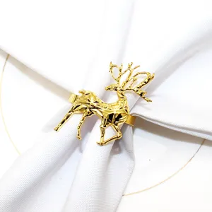 Gold geometric deer napkin ring, elegant metal table decor for Christmas and weddings.