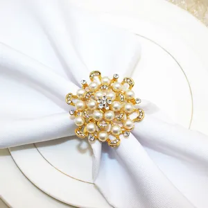 Gold pearl rhinestone napkin ring detail view, elegant table decor for weddings and hotels.