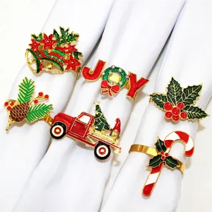 Set of 6 Christmas napkin rings featuring festive metal designs like bells, trees, and candy.
