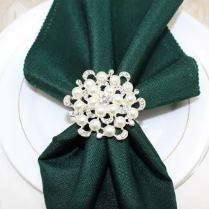 Detailed view of luxury pearl rhinestone flower napkin ring for elegant table decor.