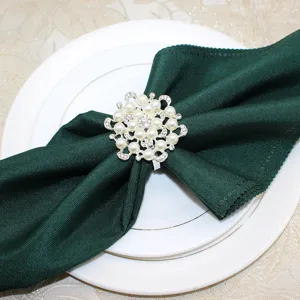 Detailed shot of pearl rhinestone napkin ring showcasing exquisite floral design.