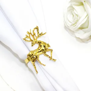 Gold geometric elk napkin ring holder for Christmas table decor, elegant dinner party accessory.