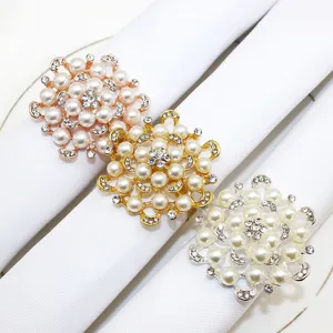 Elegant pearl rhinestone flower napkin rings set in rose gold, gold and silver for table decor.