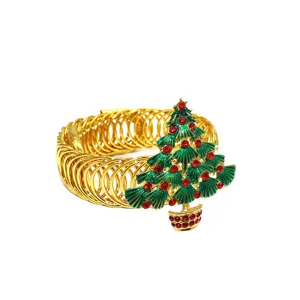 Gold metal Christmas tree curtain tieback designed with green enamel and red rhinestones.