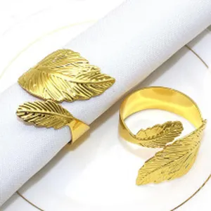 Gold leaf metal napkin ring for dining table, elegant western restaurant napkin buckle decor.