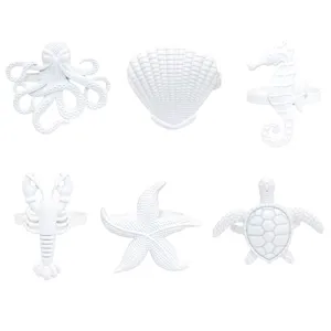 Set of 6 white nautical napkin rings featuring octopus seashell seahorse lobster starfish turtle