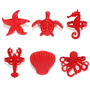 Red ocean animal napkin rings set of 6 detail view, metal starfish shell turtle table decor.