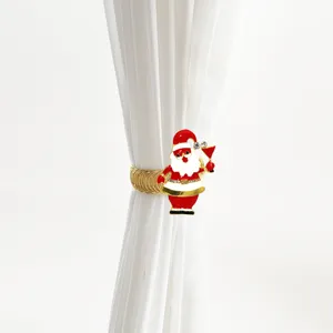 Santa Claus metal spring curtain tieback detail showing decorative holiday clip design.