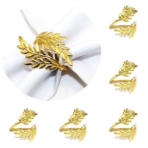 Detail shot of gold leaf napkin ring, metal napkin holder for restaurant table decor.