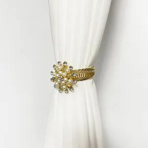 Detailed close-up shot of the elegant pearl and rhinestone curtain buckle spring tieback.
