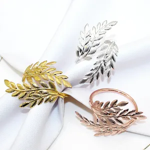 Metal leaf napkin rings in gold, silver and rose gold, detailed leaf design for table decor.