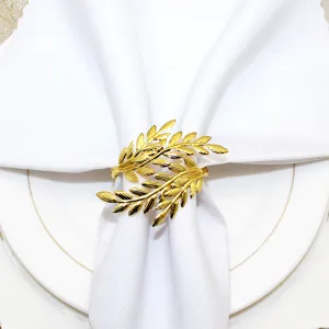 Gold metal leaf napkin ring detail view, elegant table decor for restaurants and weddings.