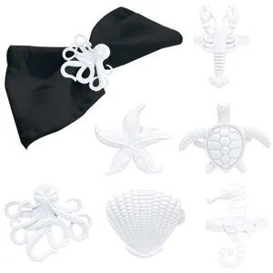 Set of 6 white metal ocean marine animal napkin rings for elegant dining table decoration.